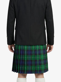 Person wearing a black coat and green plaid kilt on a white background