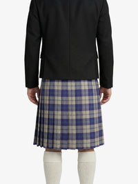 Person wearing a black jacket and blue plaid kilt on a white background