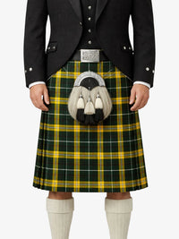 Person wearing a traditional Scottish kilt with a tartan pattern on a white background