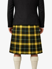 Person wearing a black jacket and yellow plaid kilt on a white background