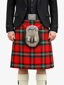Person wearing a red plaid kilt with a sporran, black jacket, and white knee-high socks on a white background.