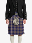 Person wearing a traditional Scottish kilt with a jacket on a white background