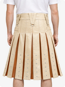 Beige pleated skirt with brown accents worn by a person on a white background