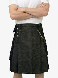 Person wearing a black kilt with gold buttons and details on a white background
