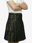 Person wearing a black kilt with gold buttons on a white background