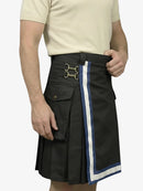 Black kilt with white and blue trim worn by a person on a plain background