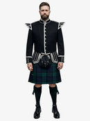 Man wearing a traditional Scottish doublet kilt outfit with a white background
