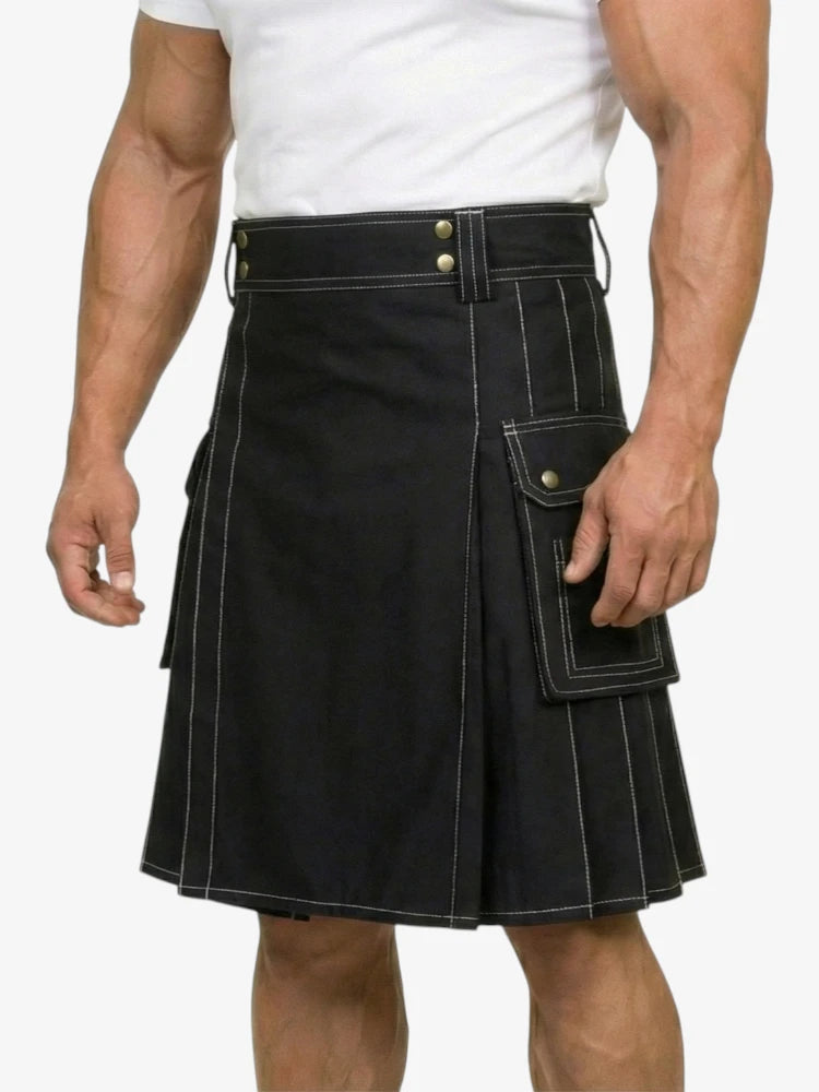 Black kilt worn by a person on a white background
