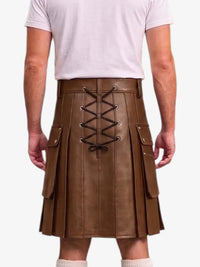 A brown faux-leather pleated kilt with a lace-up back closure, shown on a model from the back wearing a white t-shirt and white socks against a light gray background.
