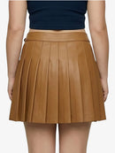 Brown pleated skirt worn by a person on a white background