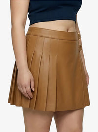Brown pleated skirt worn by a person on a white background