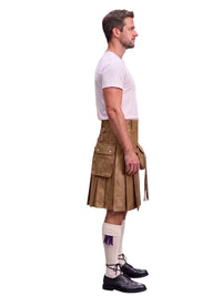 A man shown in profile wearing a tan kilt, white t-shirt, white knee-high socks with a purple graphic, and black leather shoes, against a plain white background.