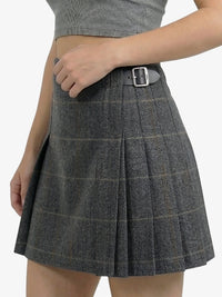 Gray checkered skirt with a belt on a white background