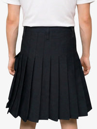 Black pleated skirt worn by a person on a white background