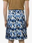 Person wearing a blue camouflage skirt on a white background
