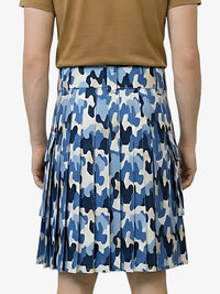 Person wearing a blue camouflage skirt on a white background