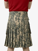 Person wearing a camouflage kilt on a white background