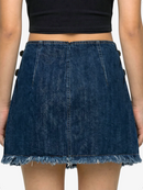 Blue denim skirt worn by a person on a white background