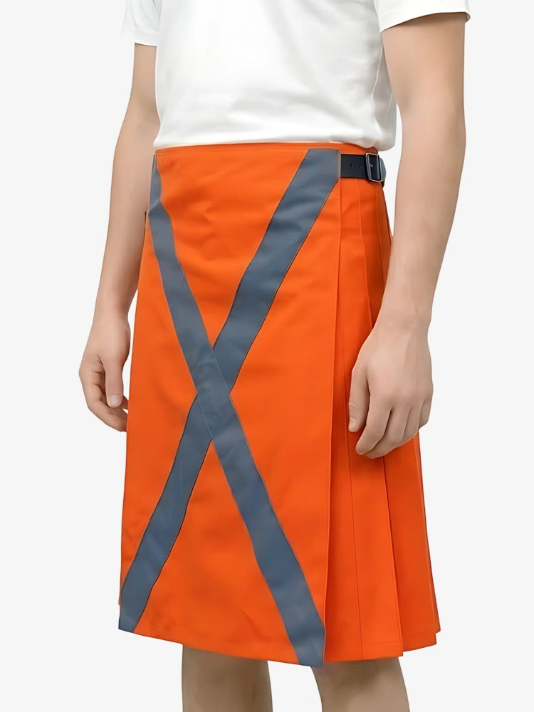 Orange skirt with reflective gray stripes worn by a person on a white background