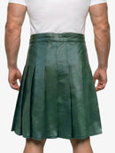 Green pleated skirt worn by a person on a white background