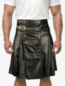 Black leather kilt with silver buckles worn by a person on a white background