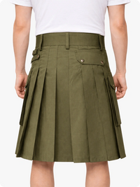Person wearing a green kilt on a white background