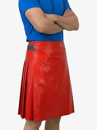 Person wearing a red leather skirt with a blue shirt on a white background