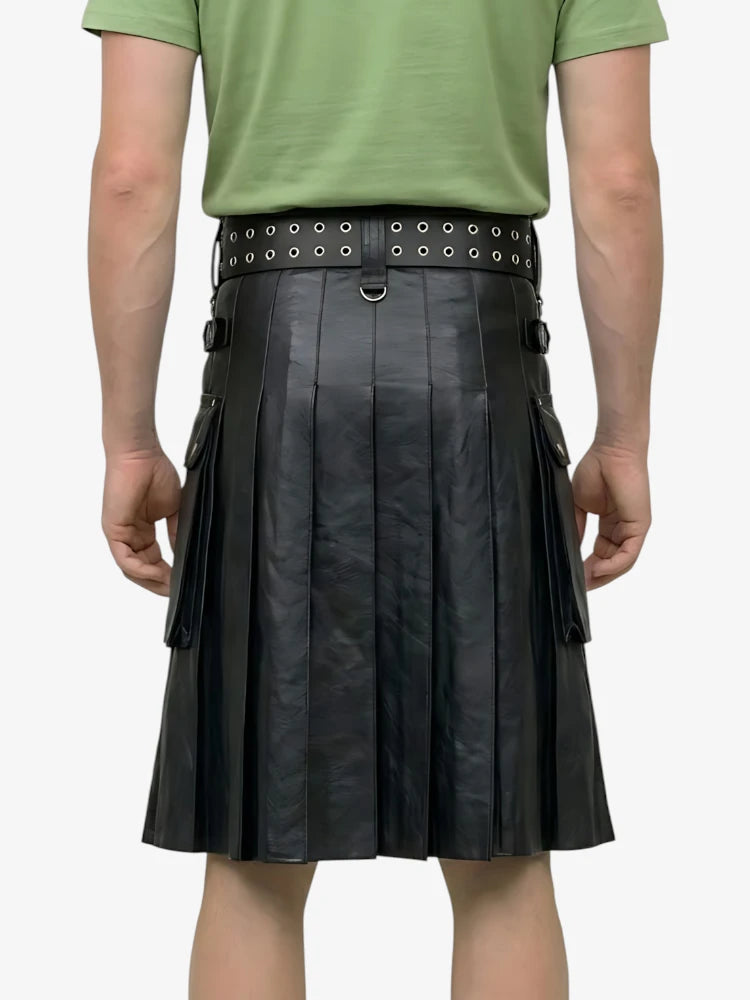 Person wearing a green shirt and black leather kilt with studded belt on a white background