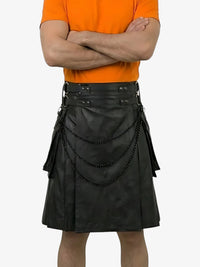 Person wearing a black leather kilt with decorative elements on a white background