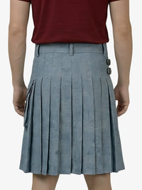 Person wearing a maroon top and gray pleated skirt on a white background