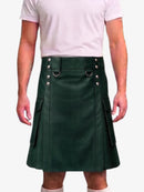 A dark green leather kilt with silver-tone metal hardware, worn by a model in a light pink t-shirt against a plain white background.