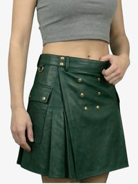 Green leather skirt with gold buttons worn by a person on a white background