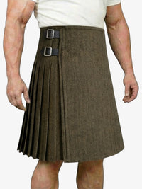 Brown pleated kilt worn by a person on a white background