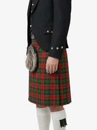 Person wearing a red tartan kilt with a black jacket on a white background