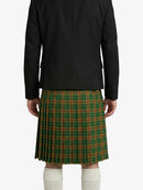 Person wearing a black jacket and green plaid kilt on a white background