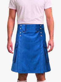 A man wearing a bright blue faux-leather kilt with silver-tone metal hardware, side pockets, and a matching belt, paired with a light pink t-shirt.