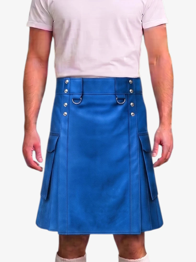 A man wearing a bright blue faux-leather kilt with silver-tone metal hardware, side pockets, and a matching belt, paired with a light pink t-shirt.