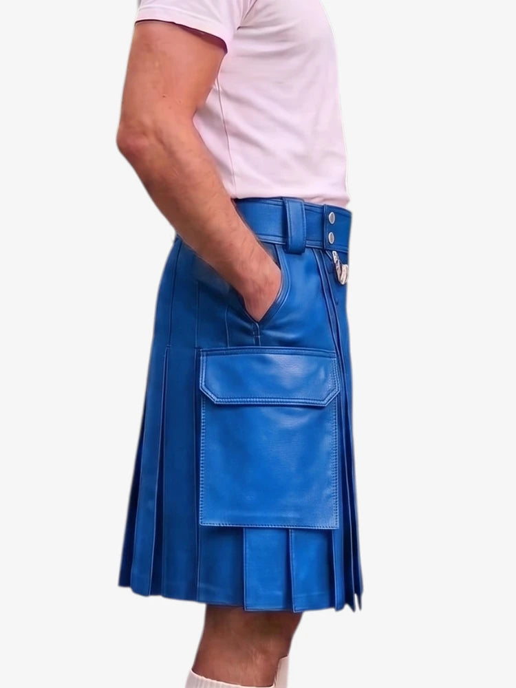 A person wearing a bright blue pleated leather kilt with a front flap pocket, paired with a light pink t-shirt, shown from the waist down against a plain white background.