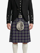 Person wearing a traditional Scottish kilt with a jacket and white knee-high socks on a white background