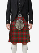 Person wearing a traditional Scottish kilt with a tartan pattern on a white background