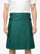 Green kilt worn by a person on a white background
