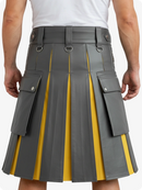 Gray and yellow pleated kilt worn by a person on a white background