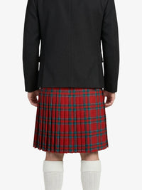 Person wearing a black jacket and red plaid kilt on a white background