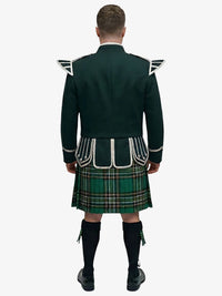 Person wearing a irish national tartan kilt with a dark green doublet jacket on a white background
