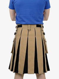 Person wearing a beige and black pleated skirt with a blue shirt on a white background