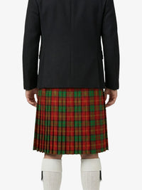 Person wearing a black coat and red plaid kilt on a white background