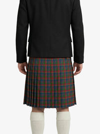 Person wearing a black jacket and plaid kilt on a white background