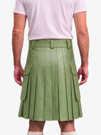 A person shown from the back wearing a light sage green pleated mini skirt with side cargo pockets and a matching belt, paired with a pale pink t-shirt.