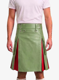 A model wearing a green faux-leather kilt with red side panels and silver metal hardware, paired with a light pink t-shirt against a white background.