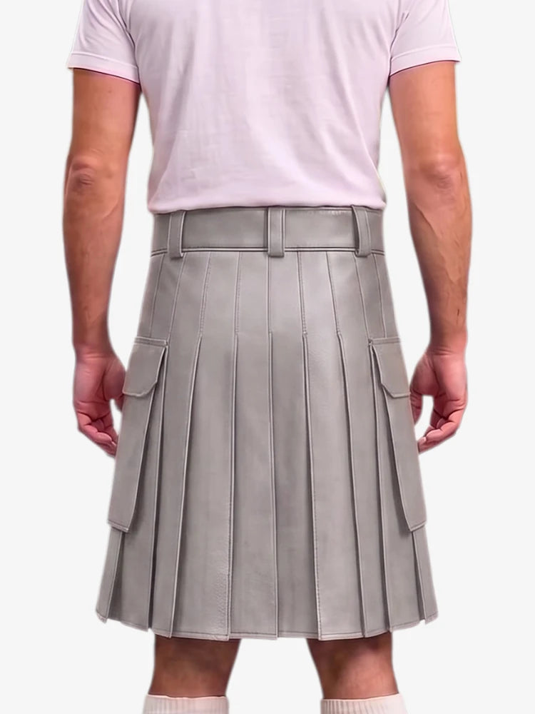 A person shown from the back wearing a light gray pleated mini skirt with side flap pockets and a matching belt, paired with a pale pink T-shirt against a light gray studio background.